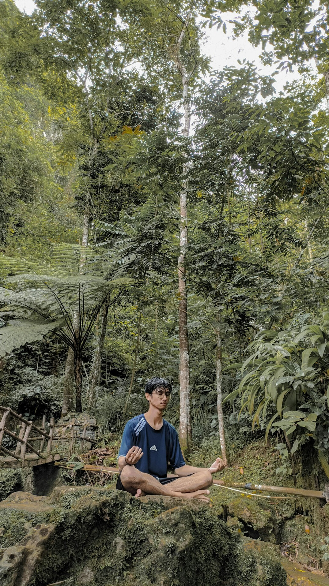 person meditating in nature